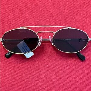 Gold Oval Sunglasses with Dark Lenses